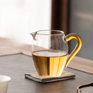 Japanese Traditional Tea Ceremony Penguin-shaped Clear Glass Gong Dao Bei With Yellow Handle For Gongfu Tea