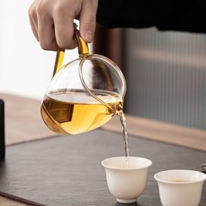 Japanese Traditional Tea Ceremony Penguin-shaped Clear Glass Gong Dao Bei With Yellow Handle For Gongfu Tea